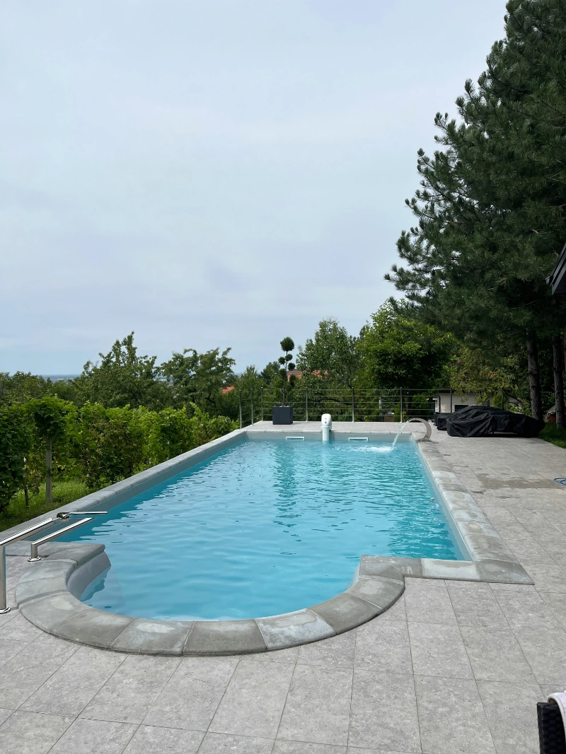 Backyard swimming pool serviced by Pool Maintenance New Braunfels