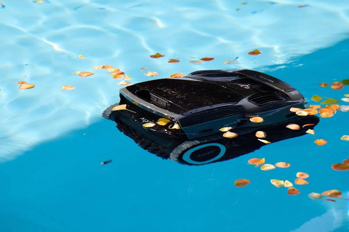 Robotic pool cleaner restoring a swimming pool during a recovery service in New Braunfels, TX