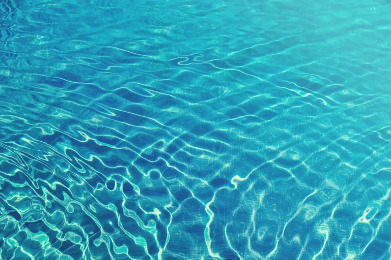 Crystal clear pool water confirming proper weekly service